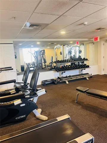 a room with lots of gym equipment