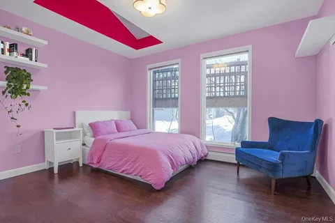 a bedroom with a bed and a couch