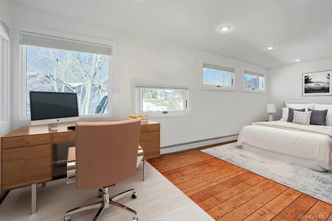 a bedroom with a workspace