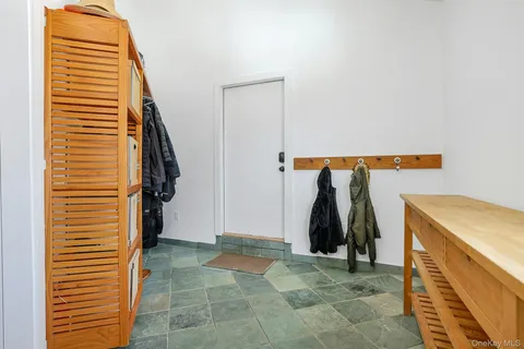 a view of walk in closet with clothes