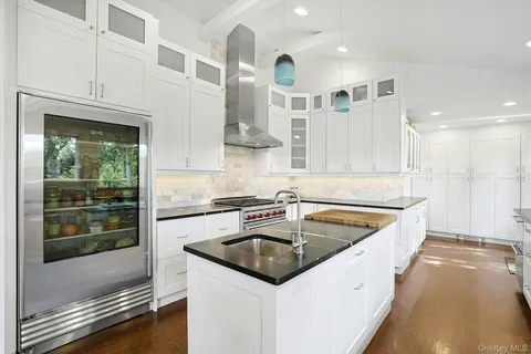 a kitchen that has a sink and a stove
