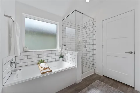 a bathroom with a bathtub and a sink