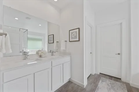 a bathroom with 2 sink and a mirror