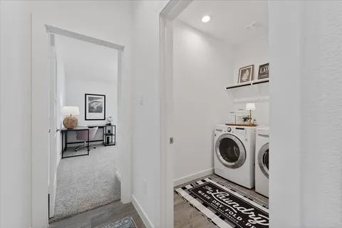 a utility room with sink dryer and washer