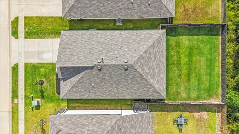 a aerial view of a house with a garden