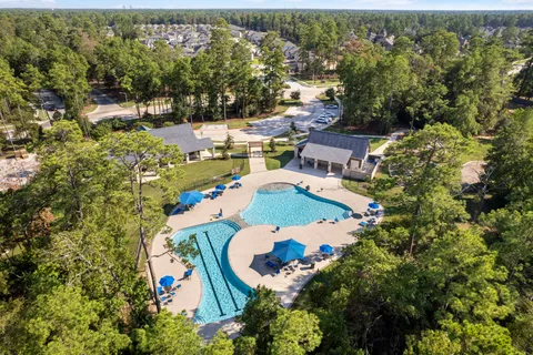 an aerial view of residential houses with outdoor space