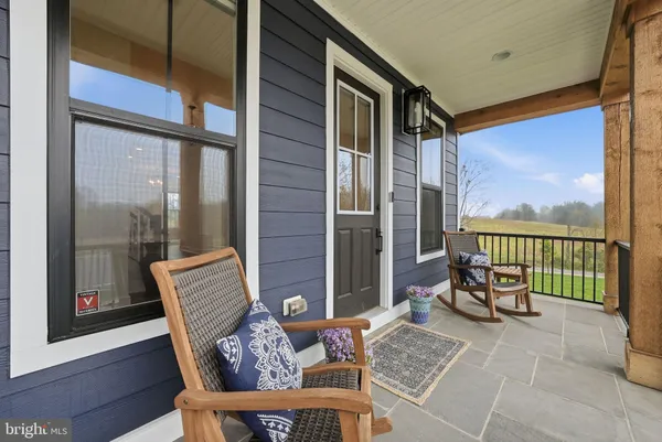 a balcony with furniture and outdoor view