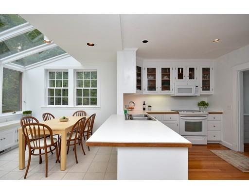 642 Worcester Street Wellesley, MA 02482 - Photo 12 of 23 a kitchen with a dining table chairs and stove