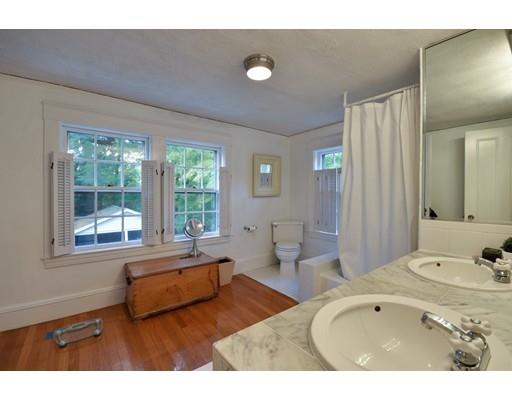 642 Worcester Street Wellesley, MA 02482 - Photo 16 of 23 a bathroom with a tub sink and mirror