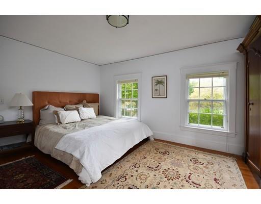 642 Worcester Street Wellesley, MA 02482 - Photo 17 of 23 a bedroom with a bed and a window