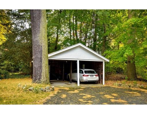 642 Worcester Street Wellesley, MA 02482 - Photo 23 of 23 a front view of a house with a garden and trees