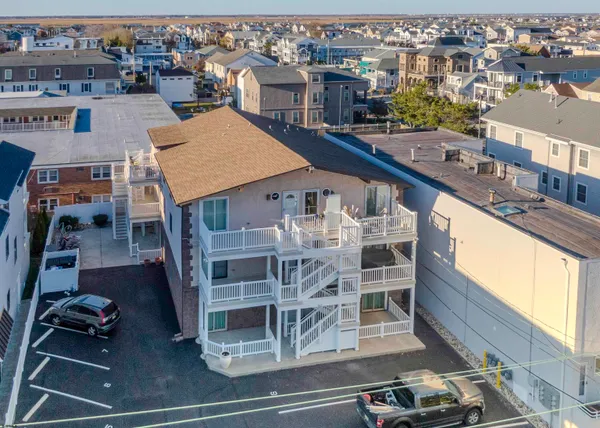 an aerial view of a house with a ocean view