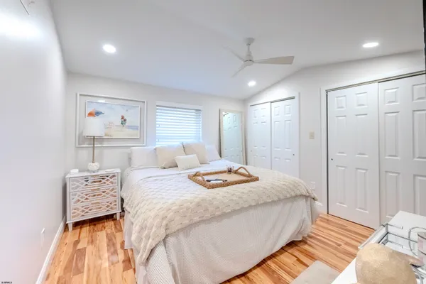 a bedroom with a bed and a mirror