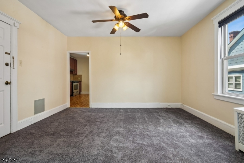 7 Beekman Street, Unit 2 Bloomfield, NJ 07003 - Photo 14 of 27 a view of an empty room with a window