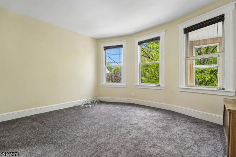 7 Beekman Street, Unit 2 Bloomfield, NJ 07003 - Photo 15 of 27 an empty room with windows