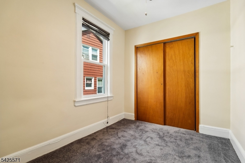 7 Beekman Street, Unit 2 Bloomfield, NJ 07003 - Photo 22 of 27 a view of an empty room with a window