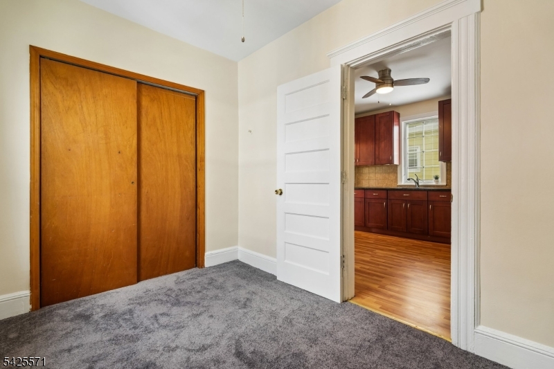 7 Beekman Street, Unit 2 Bloomfield, NJ 07003 - Photo 23 of 27 wooden floor and closet in a room