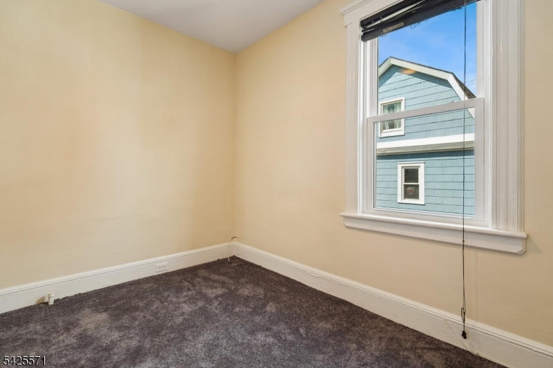 7 Beekman Street, Unit 2 Bloomfield, NJ 07003 - Photo 24 of 27 a view of empty room with windows