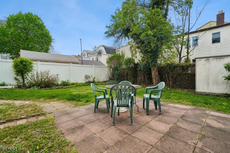 7 Beekman Street, Unit 2 Bloomfield, NJ 07003 - Photo 27 of 27 a view of a chairs and table in backyard of the house