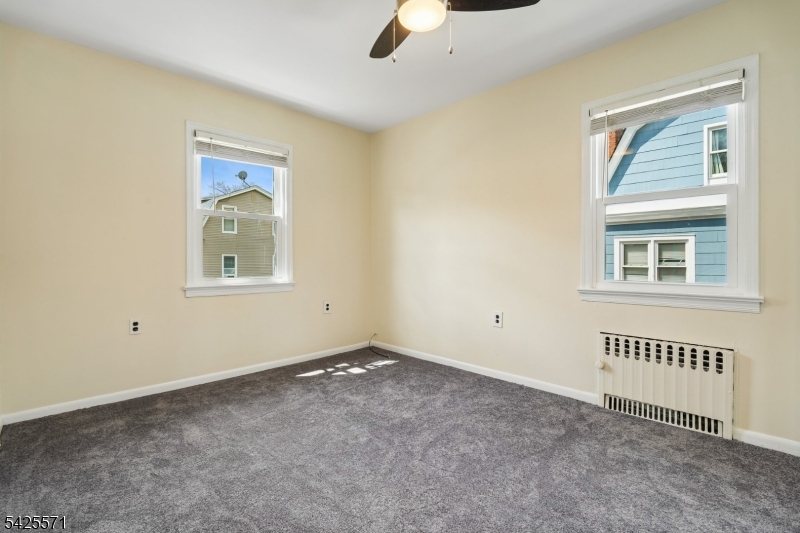 7 Beekman Street, Unit 2 Bloomfield, NJ 07003 - Photo 8 of 27 a view of an empty room with a window