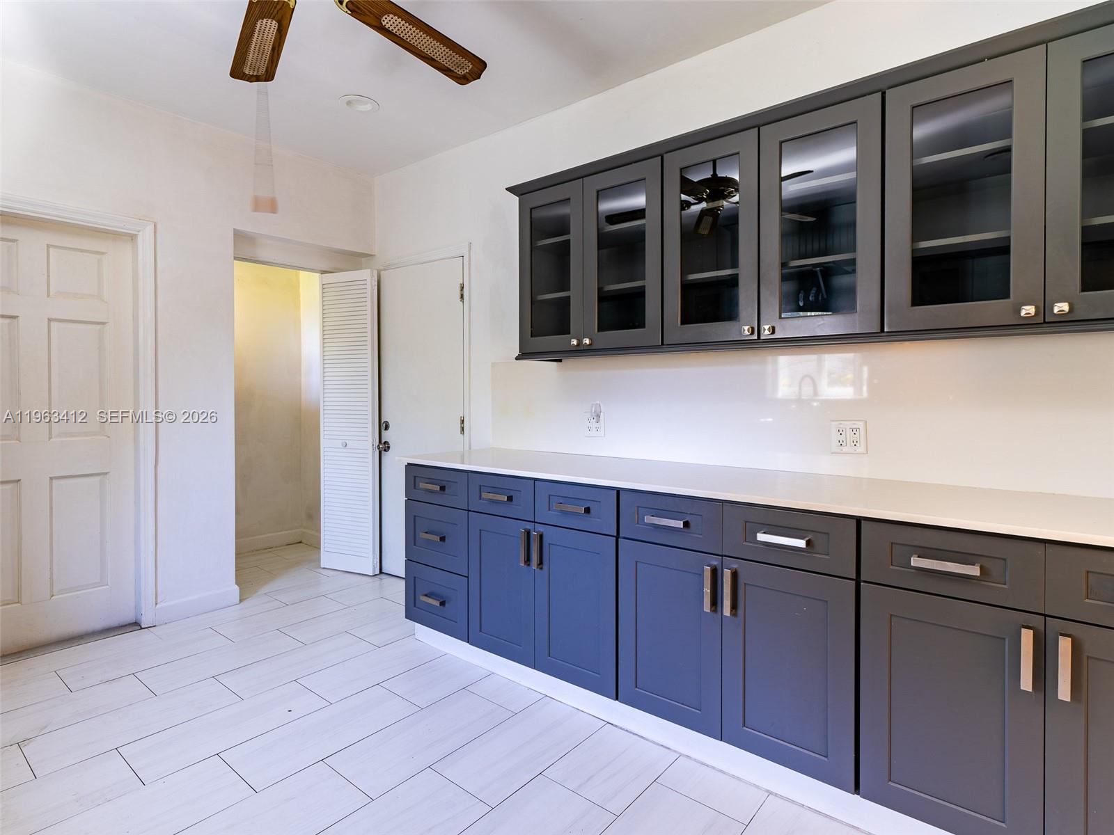 630 Southwest 25th Road Miami, FL 33129 - Photo 14 of 35 a spacious bathroom with a granite countertop sink and mirror