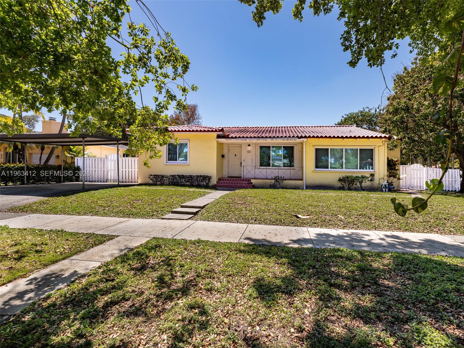 630 Southwest 25th Road Miami, FL 33129 - Photo 2 of 35 front view of house with a yard