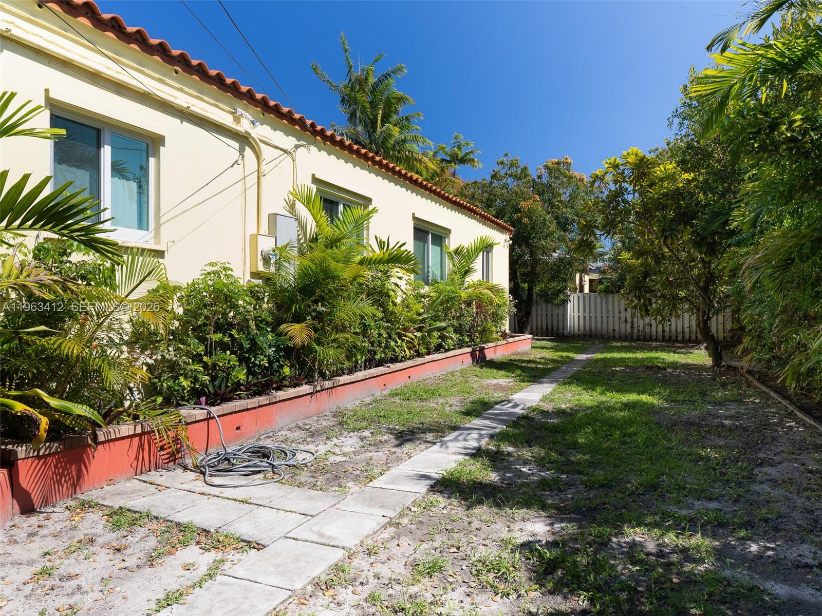 630 Southwest 25th Road Miami, FL 33129 - Photo 29 of 35 a view of a back yard with flower plants