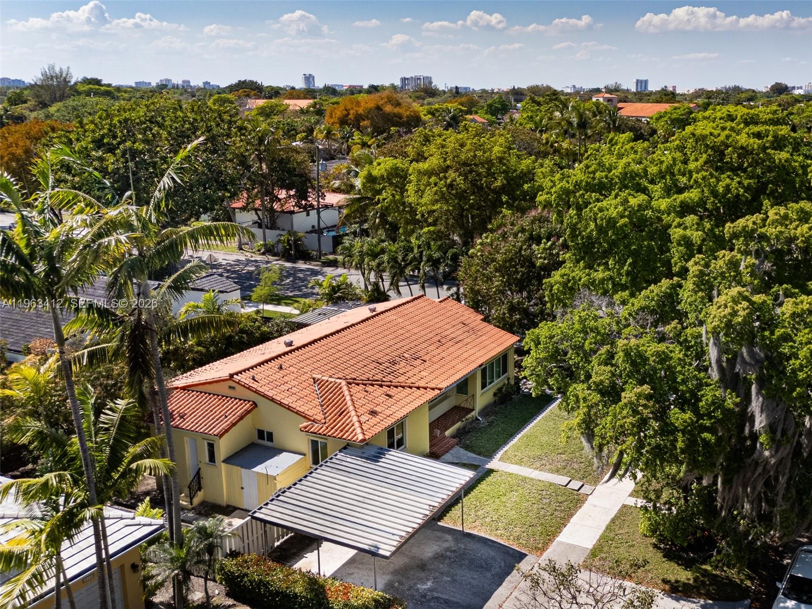 630 Southwest 25th Road Miami, FL 33129 - Photo 34 of 35 an aerial view of a house with a yard