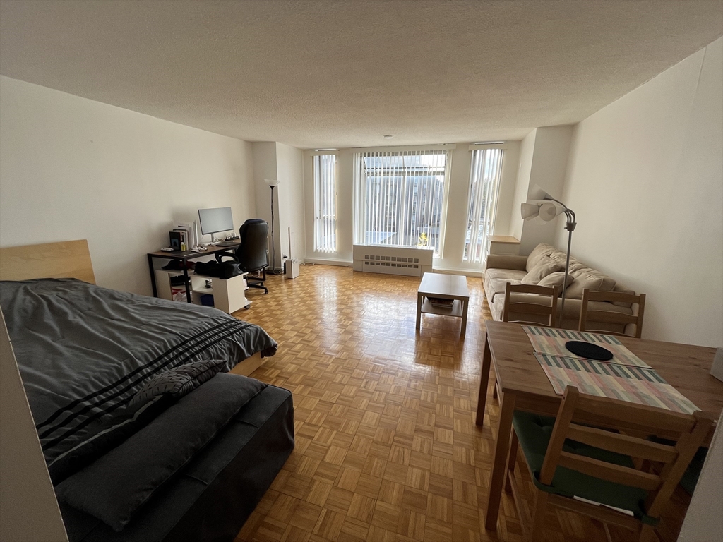 44 Washington Street, Unit 606 Brookline, MA 02445 - Photo 2 of 21 a living room with furniture and wooden floor