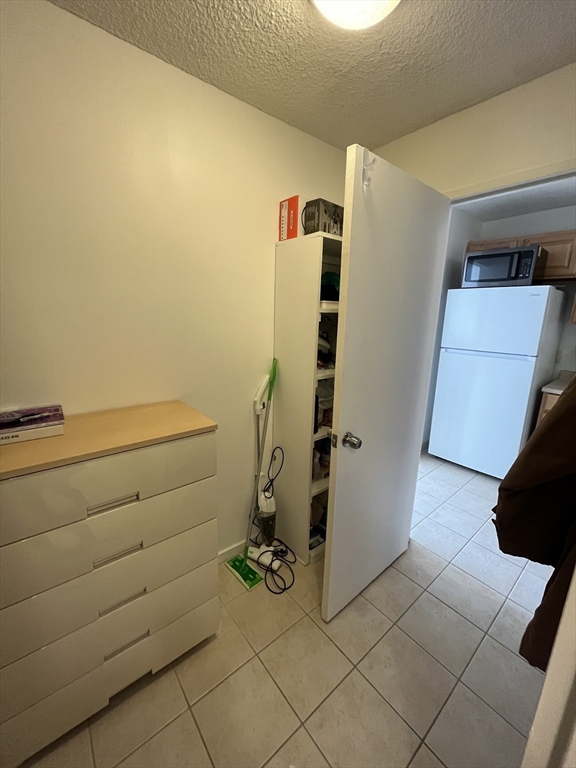 44 Washington Street, Unit 606 Brookline, MA 02445 - Photo 5 of 21 a bathroom with a sink and a shower