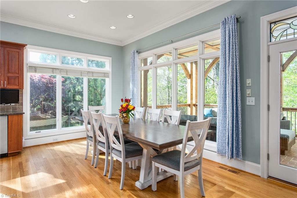 6699 Fegan Road Summerfield, NC 27358 - Photo 13 of 50 Breakfast area overlooking covered porch and pond.