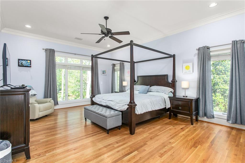 6699 Fegan Road Summerfield, NC 27358 - Photo 15 of 50 Primary bedroom overlooks 4 acre pond.