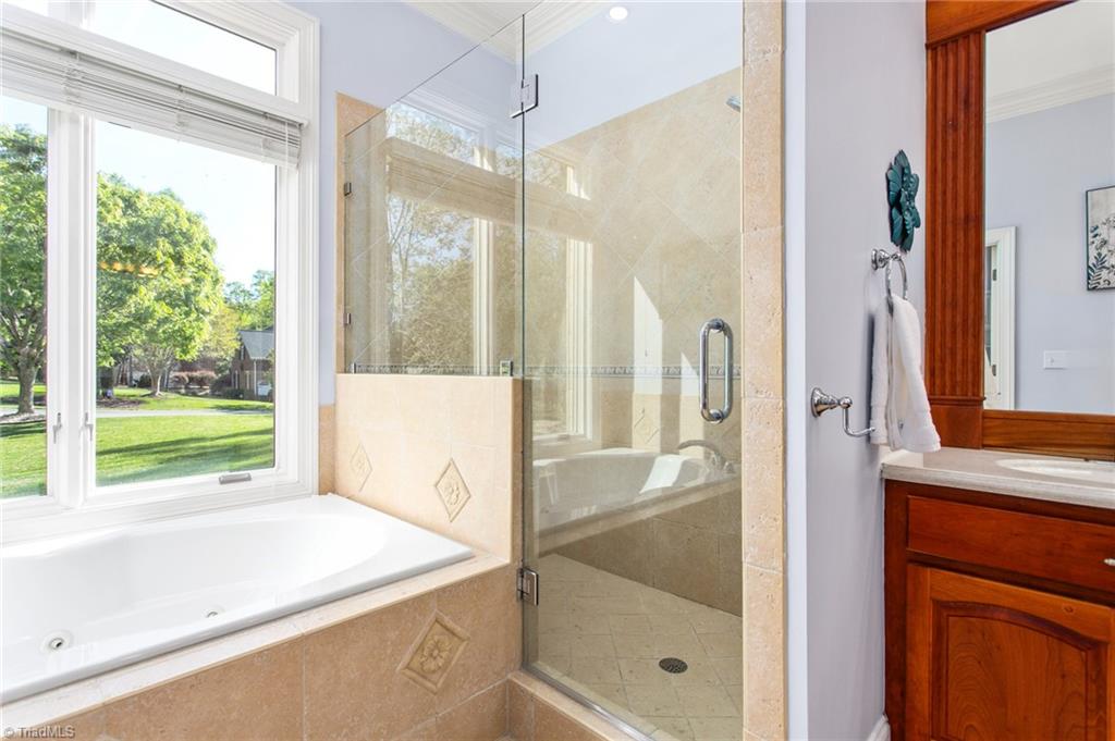 6699 Fegan Road Summerfield, NC 27358 - Photo 20 of 50 Full shower with built in shower seat