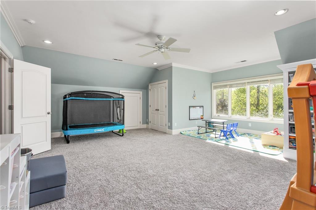 6699 Fegan Road Summerfield, NC 27358 - Photo 24 of 50 Bonus room with sitting area. Can be used as a bedroom, office, exercise space, etc.