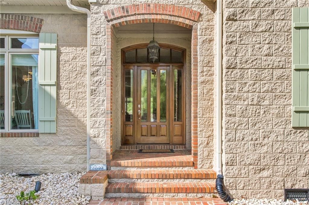 6699 Fegan Road Summerfield, NC 27358 - Photo 4 of 50 Custom mahogany door with imported German water glass.