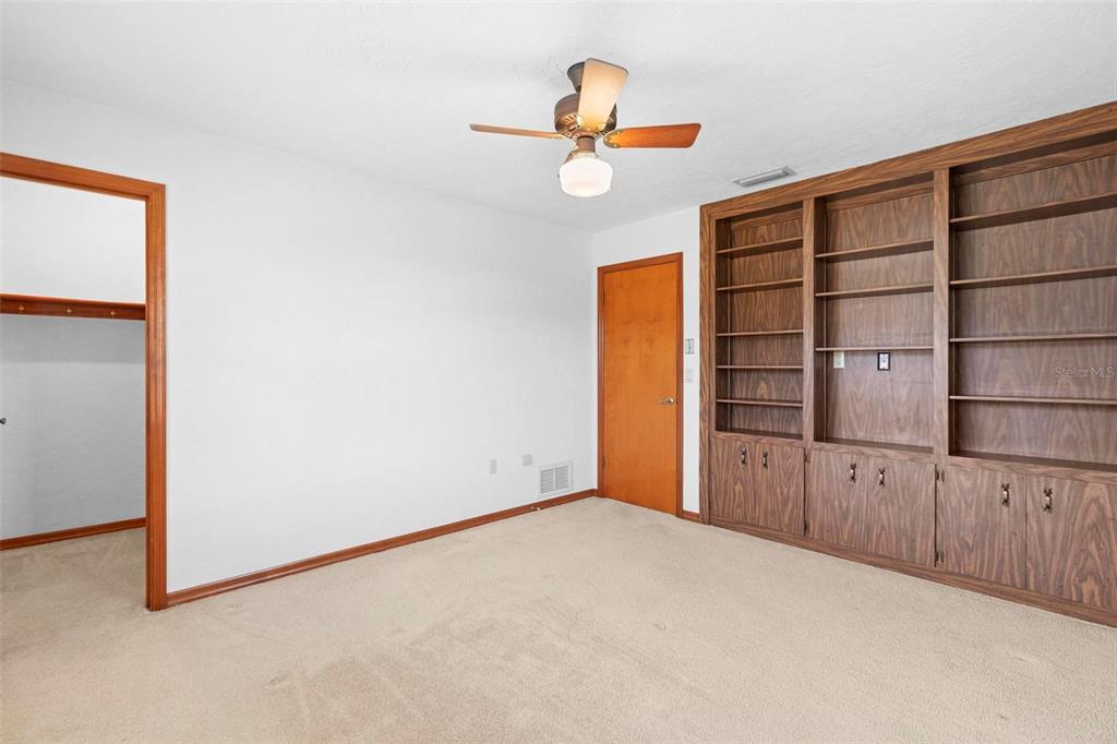 830 Freemans Farm Road DeLand, FL 32720 - Photo 29 of 43 BEDROOM 3 WITH BUILT IN SHELVING