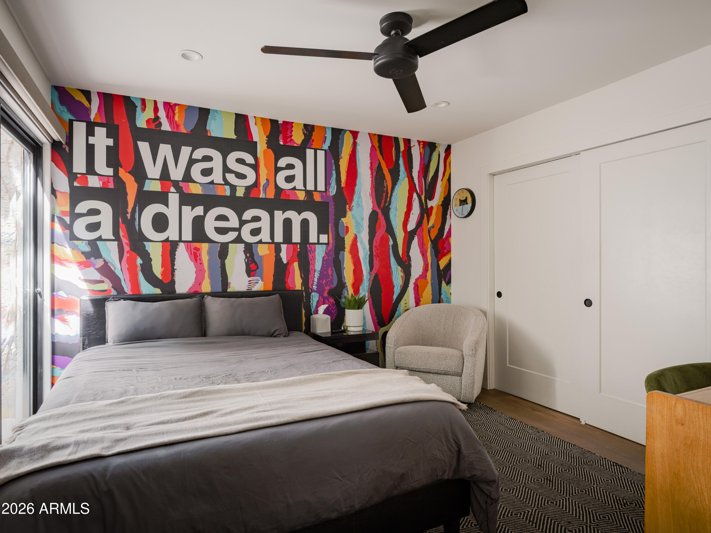 4620 North 40th Street Phoenix, AZ 85018 - Photo 15 of 26 a bedroom with a bed and a painting on the wall