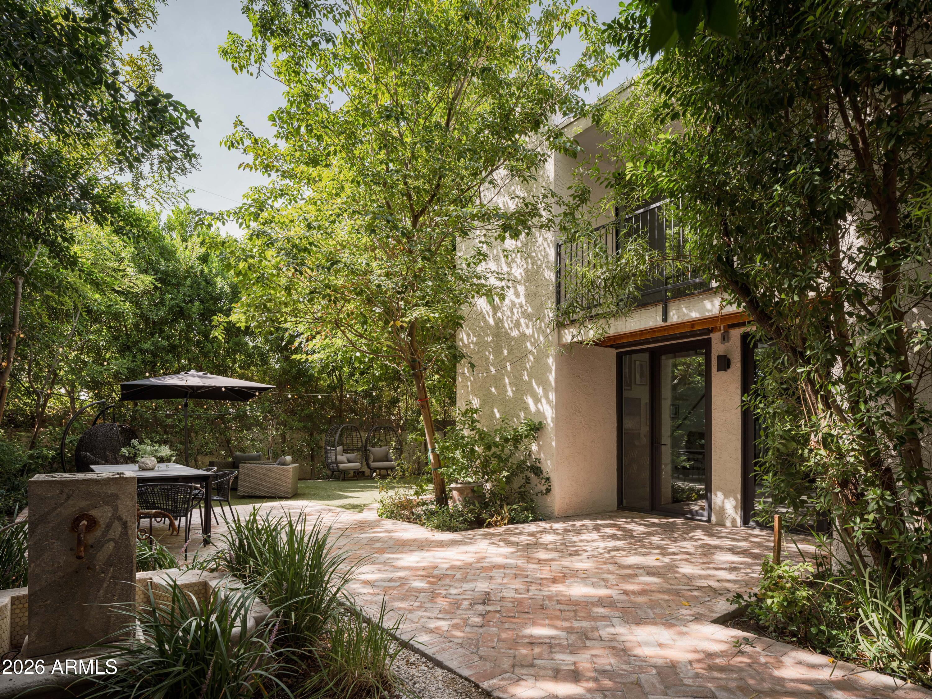 4620 North 40th Street Phoenix, AZ 85018 - Photo 18 of 26 a view of a house with a yard plants and large tree