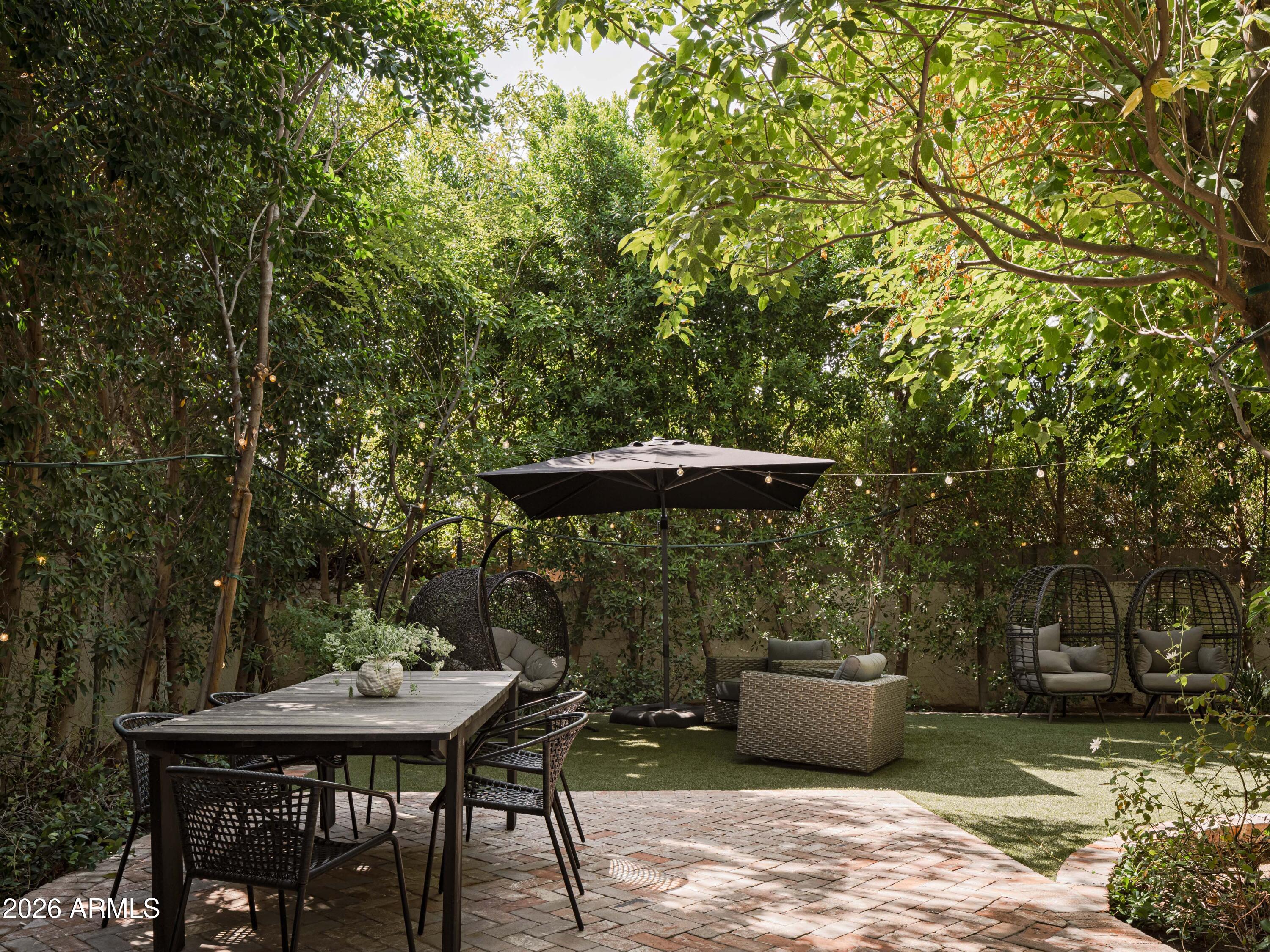 4620 North 40th Street Phoenix, AZ 85018 - Photo 19 of 26 a backyard of a house with table and chairs