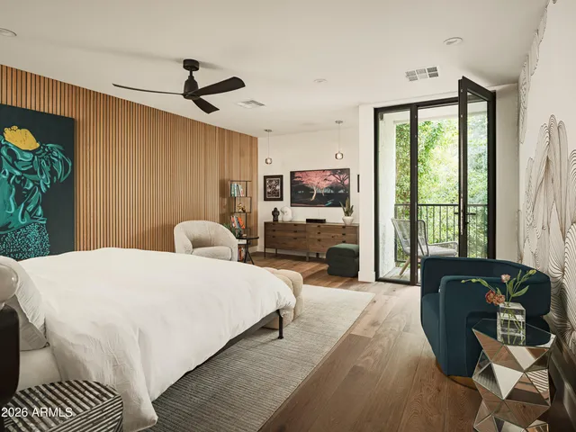 a bed room with a bed window and a chair