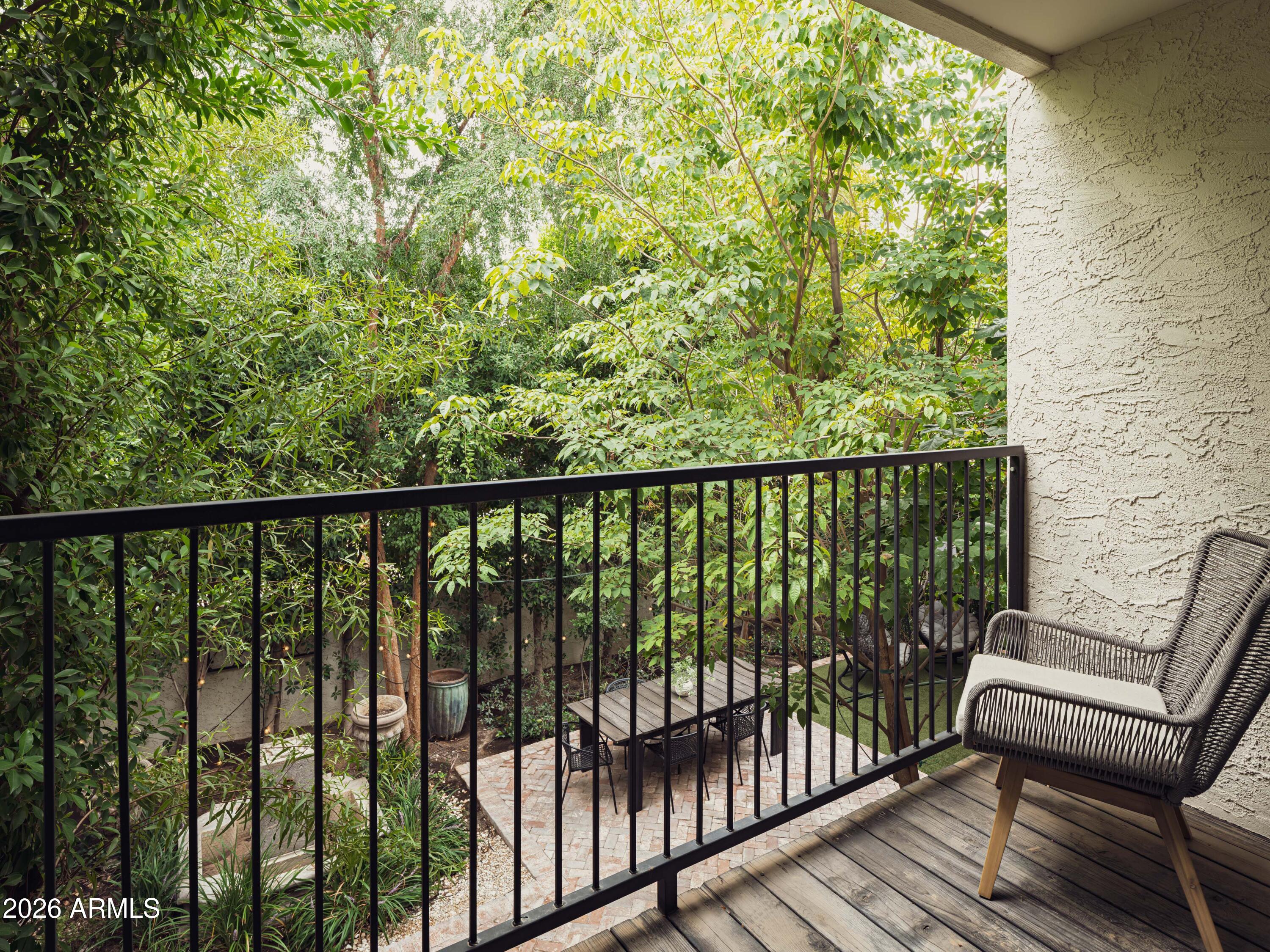4620 North 40th Street Phoenix, AZ 85018 - Photo 9 of 26 a view of a balcony with wooden floor