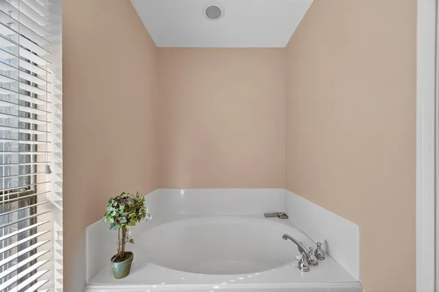 a white bath tub sitting in a bathroom