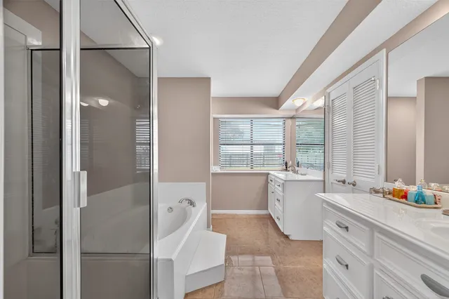 a bathroom with a sink and a window