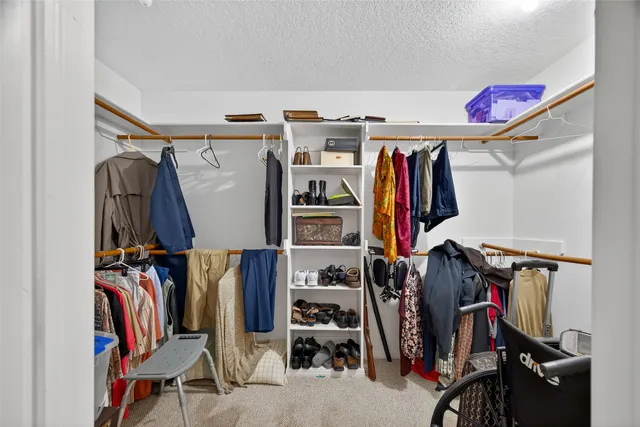 a patio with table and chairs and a barbeque