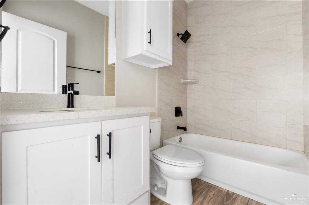 437 5th Street La Joya, TX 78560 - Photo 7 of 9 a bathroom with a sink a toilet and shower