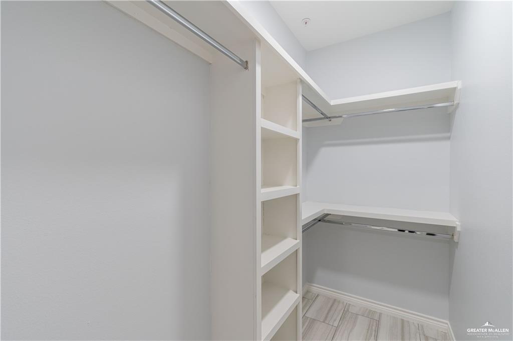 1306 Royola Street Mission, TX 78572 - Photo 13 of 16 a view of walk in closet with empty racks