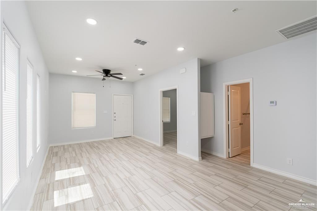 1306 Royola Street Mission, TX 78572 - Photo 8 of 16 wooden floor in an empty room with a window