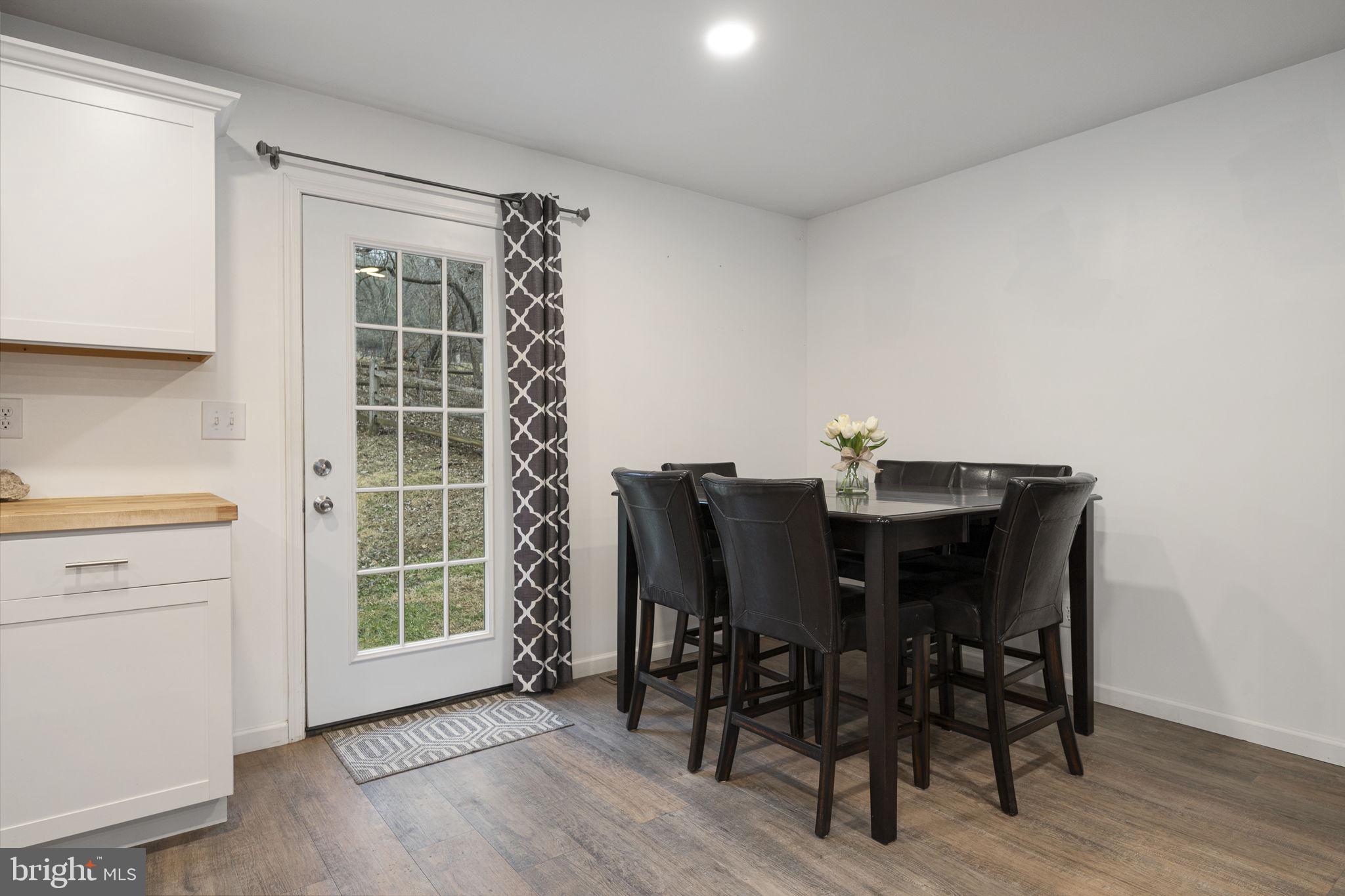 150 Modena Road Coatesville, PA 19320 - Photo 18 of 31 a view of a dining room with furniture and wooden floor