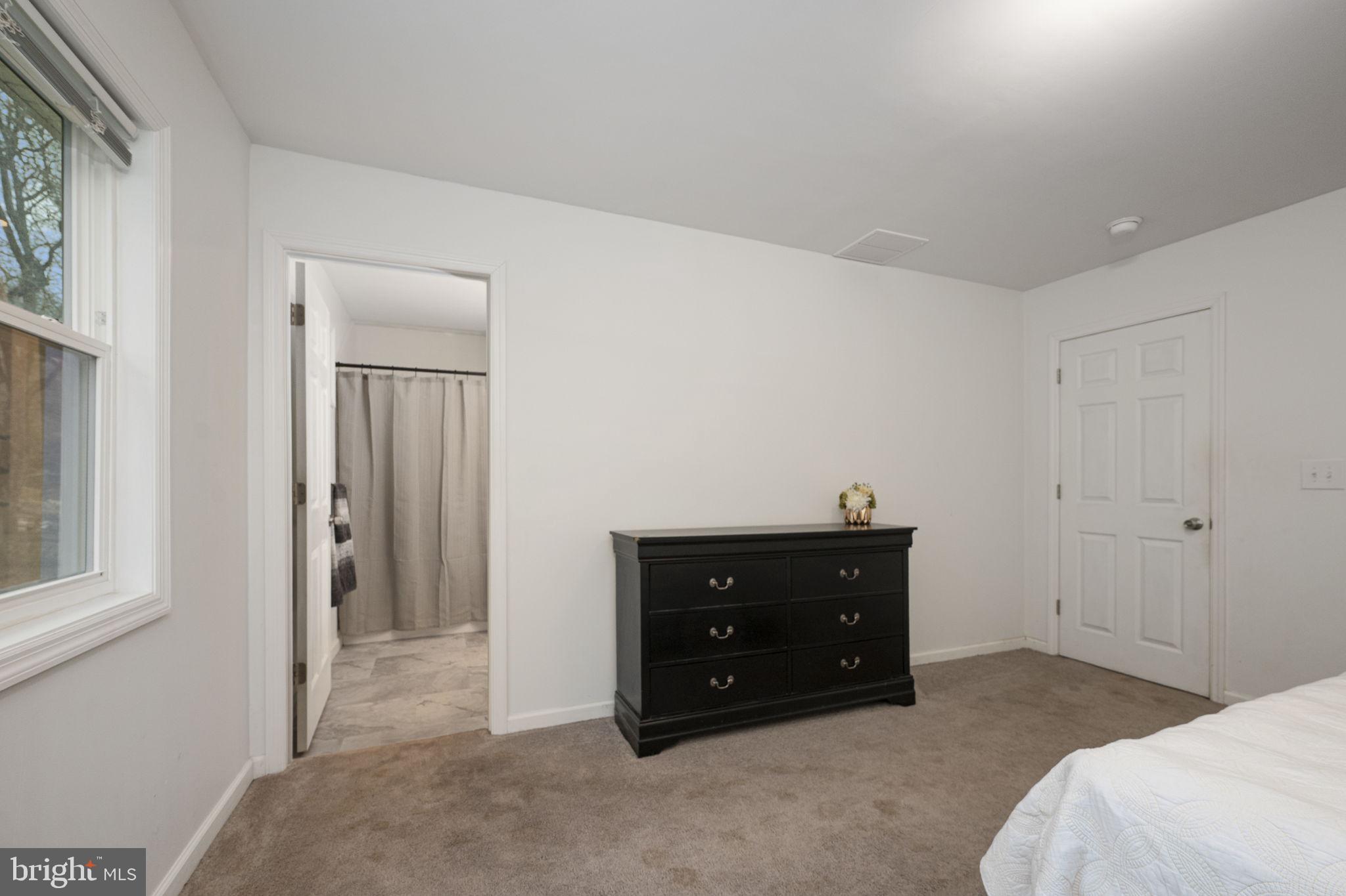 150 Modena Road Coatesville, PA 19320 - Photo 20 of 31 a bed room with a bed and a mirror