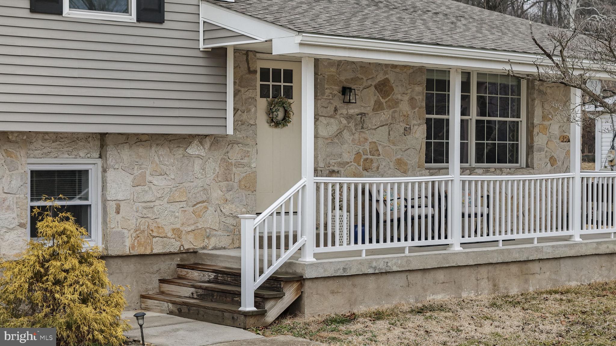 150 Modena Road Coatesville, PA 19320 - Photo 2 of 31 a porch with a bench next to a window